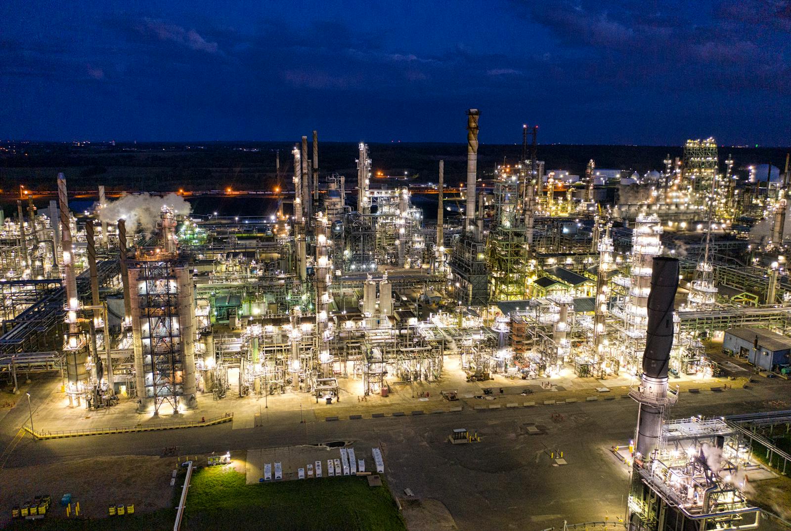 Aerial view of oil terminal and fuel storage tanks at night